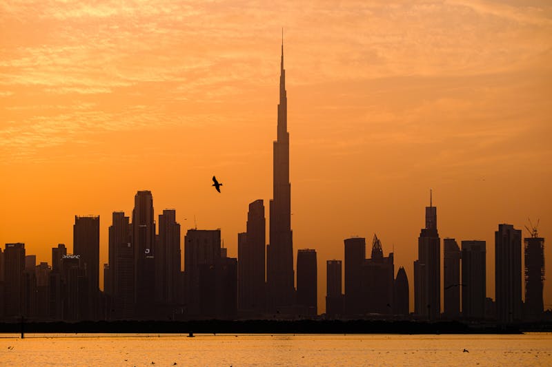 Burj Khalifa towers over the Dubai skyline at sunset